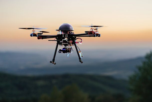 Drone flying at sunset